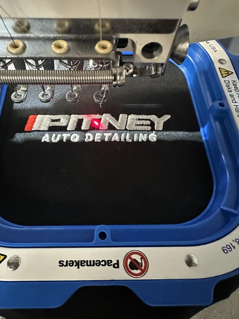 Pitney Auto Detailing logo on the embroidery machine