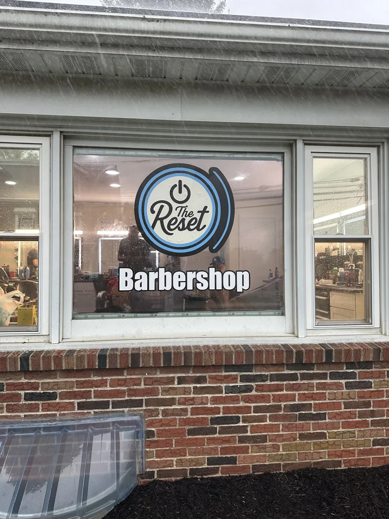 The Reset Barbershop window graphics